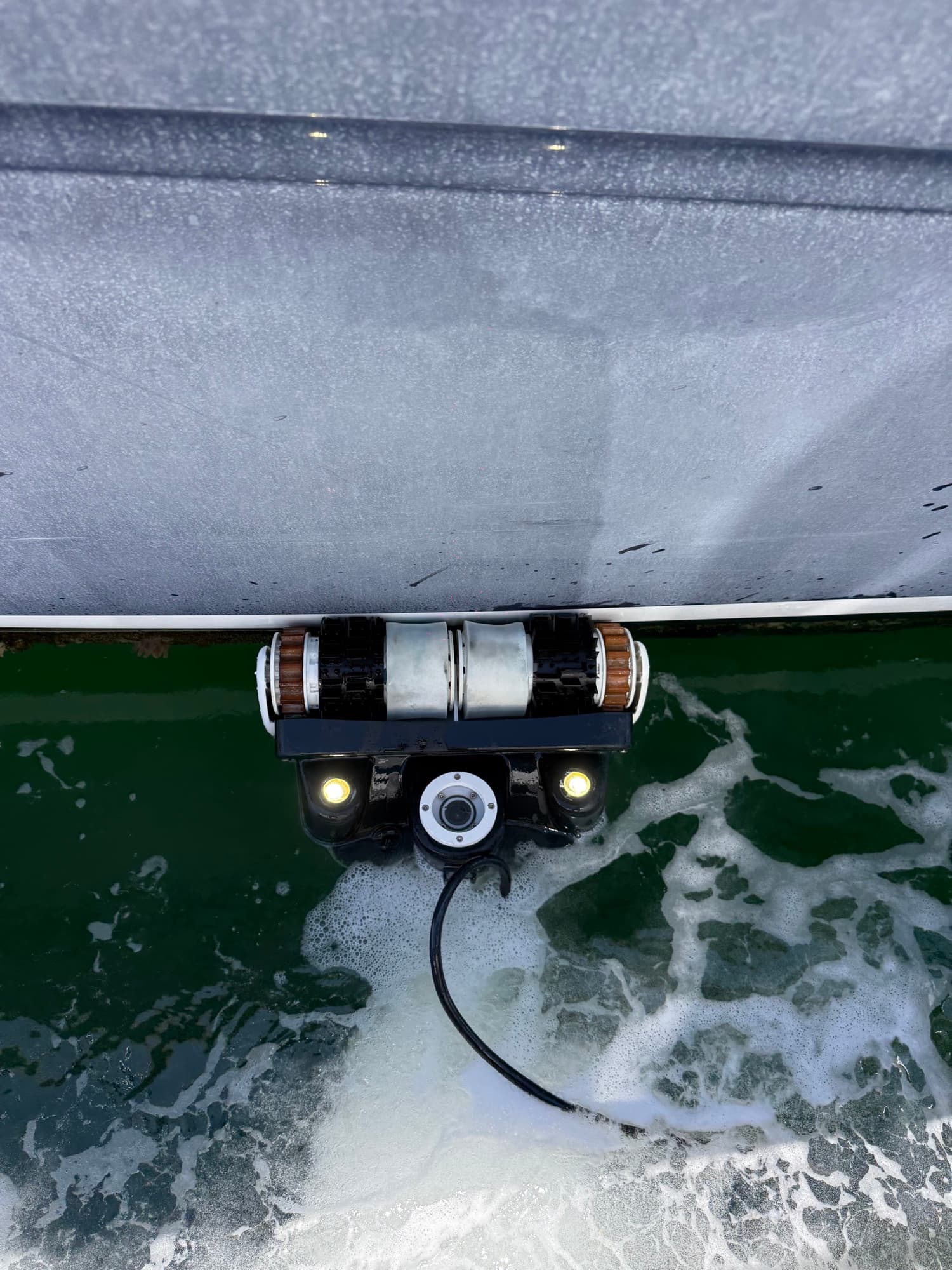 The Tide Bot ROV working along a hull at the waterline